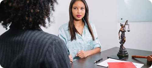 Woman discussing legal remedies with a lawyer